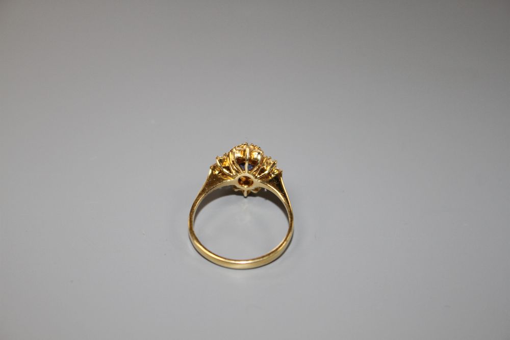 A modern 18ct gold, sapphire and diamonds set quatrefoil shaped cluster ring, size M, gross 4 grams